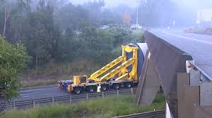 Warrego Highway Accident: Westbound Lanes Closed After Truck Carrying Wind Turbine Hits Bridge